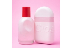 Image Two pink Glossier products in front of a pink background.
